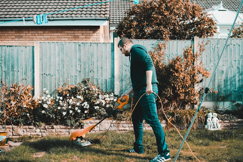 a man mowing his lawn